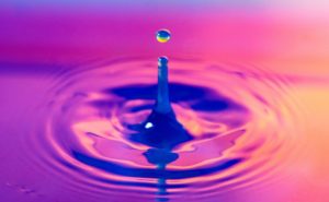 What are binaural beats water droplet into water, with ripples